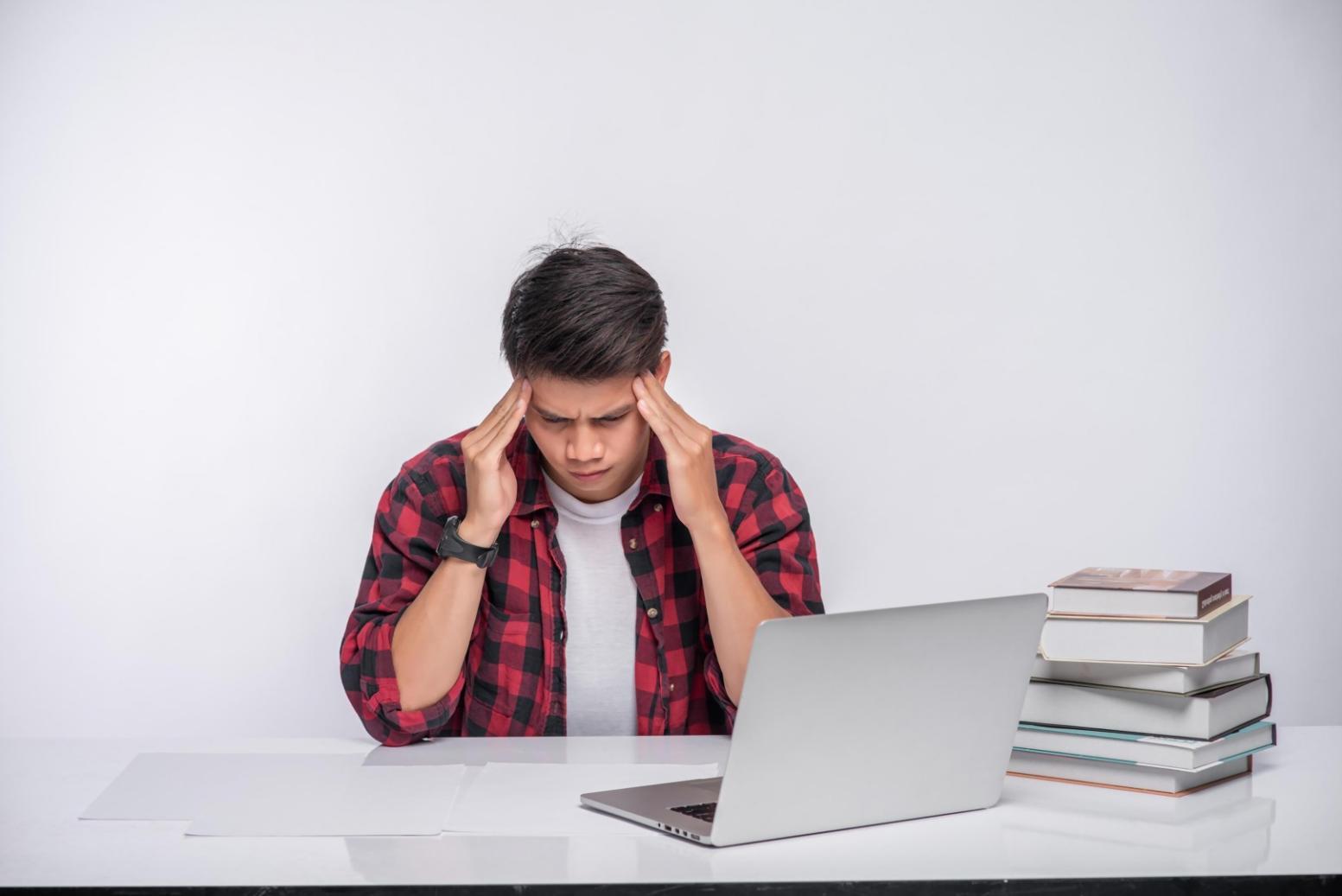 Person reviewing financial documents and budgeting materials